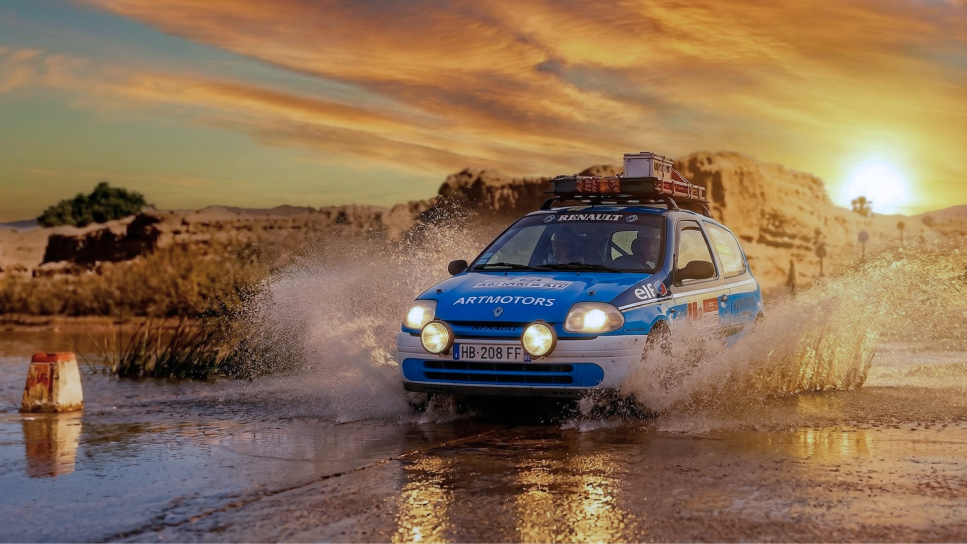 Clio traversant un gué au coucher du soleil